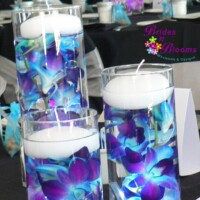 Brides N Blooms, submerged Orchid Centerpiece with Candles Brides N Blooms, submerged Orchid Centerpiece with Candles