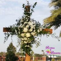 Flowers on wooden cross