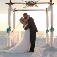 Beach Wedding bride, groom, arch