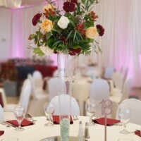 Tall Red, White, Peach with greenery centerpiece Tall Red, White, Peach with greenery centerpiece
