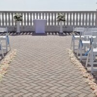 Floral Arrangements on Columns with Aisle Petals