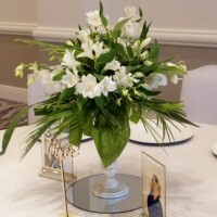 Greenery & Alstromeria on white pedestal Greenery & Alstromeria on white pedestal