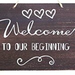 Welcome To Our Beginning - Wedding Sign. JennyGems Wedding Sign - Welcome To Our Beginning - Wedding Ceremony and Reception Decorations - Rustic Welcome Sign - Wooden Home Signs - Farmhouse Decor Welcome To Our Beginning - Wedding Sign. 10 x 12 x .25 Inches. This wooden sign has an intentional rustic distressed vintage primitive look.
